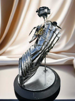 Gauntlet holding steel rose