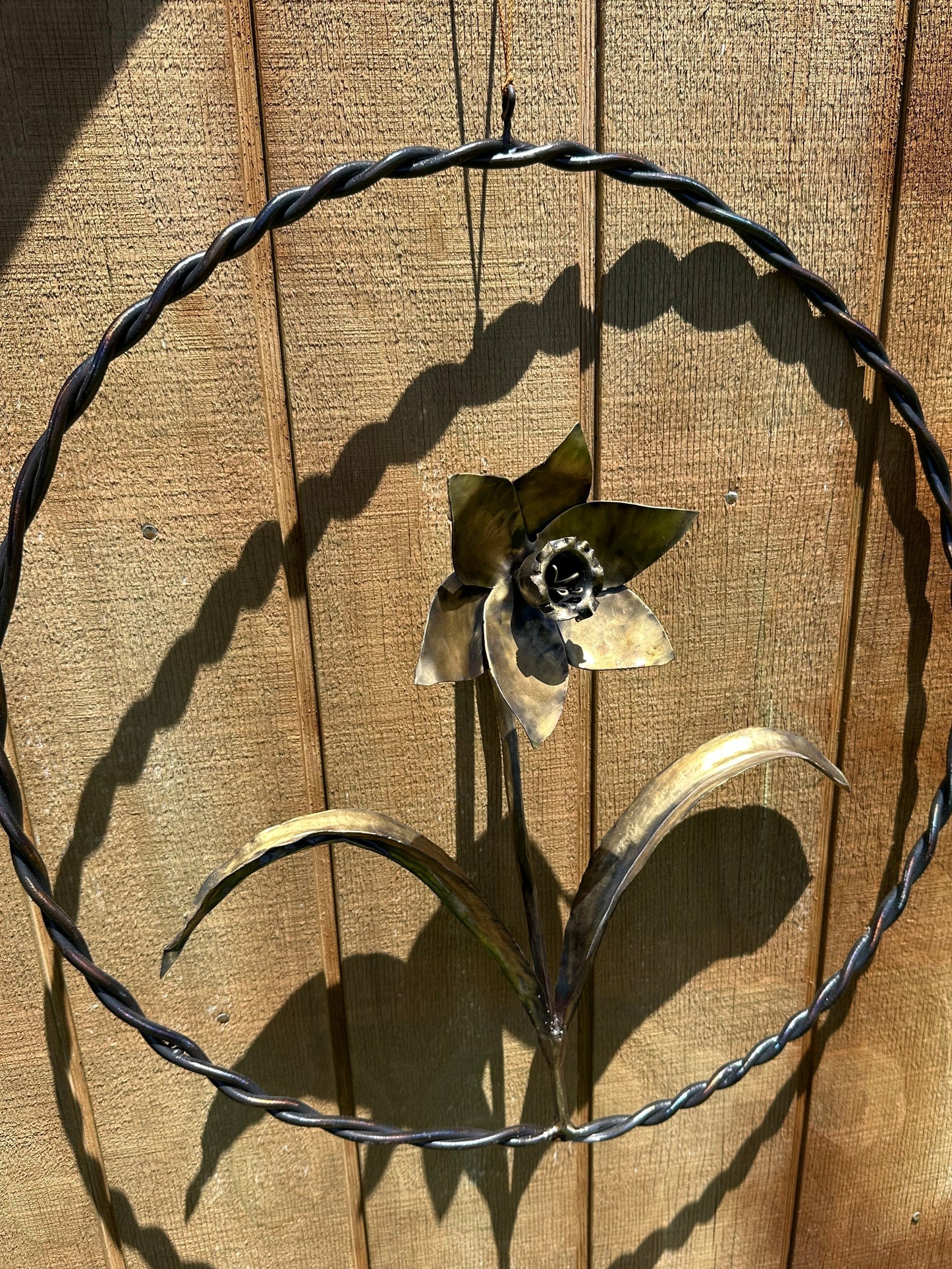 Handmade steel daffodil artwork by blacksmith Justin Stockbridge.