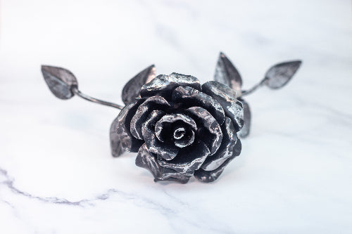 A steel rose: hand-forged, everlasting, and elegant. A timeless symbol of strength, love, and commitment, crafted to never wilt or fade.