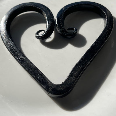 Stunning and simple this is a metal wrought iron heart made by an NZ blacksmith