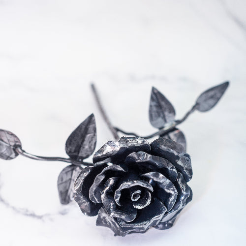 steel rose as seen from the front of the rose. there is also the leaves featured which can have custom names added for free