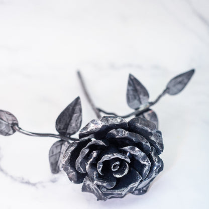 steel rose as seen from the front of the rose. there is also the leaves featured which can have custom names added for free