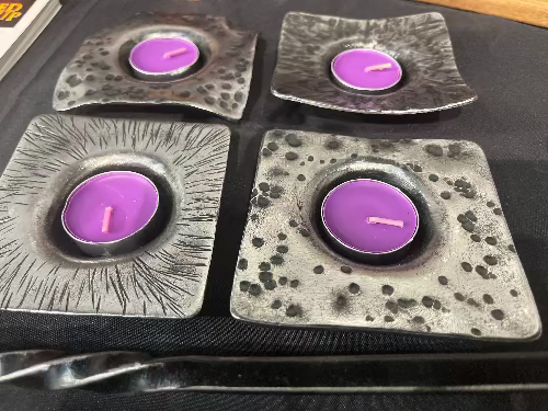 A mixed lot of steel candle holders. thick steel these have real weight to them. made by Blacksmith Justin 