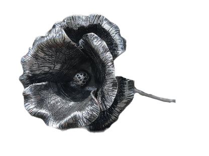 "Hand-forged steel poppy, symbolizing resilience and remembrance with everlasting beauty."